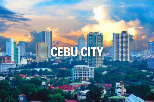 A photo of Cebu city with buildings and a vibrant sky as the background, the city is known for its lower cost of living